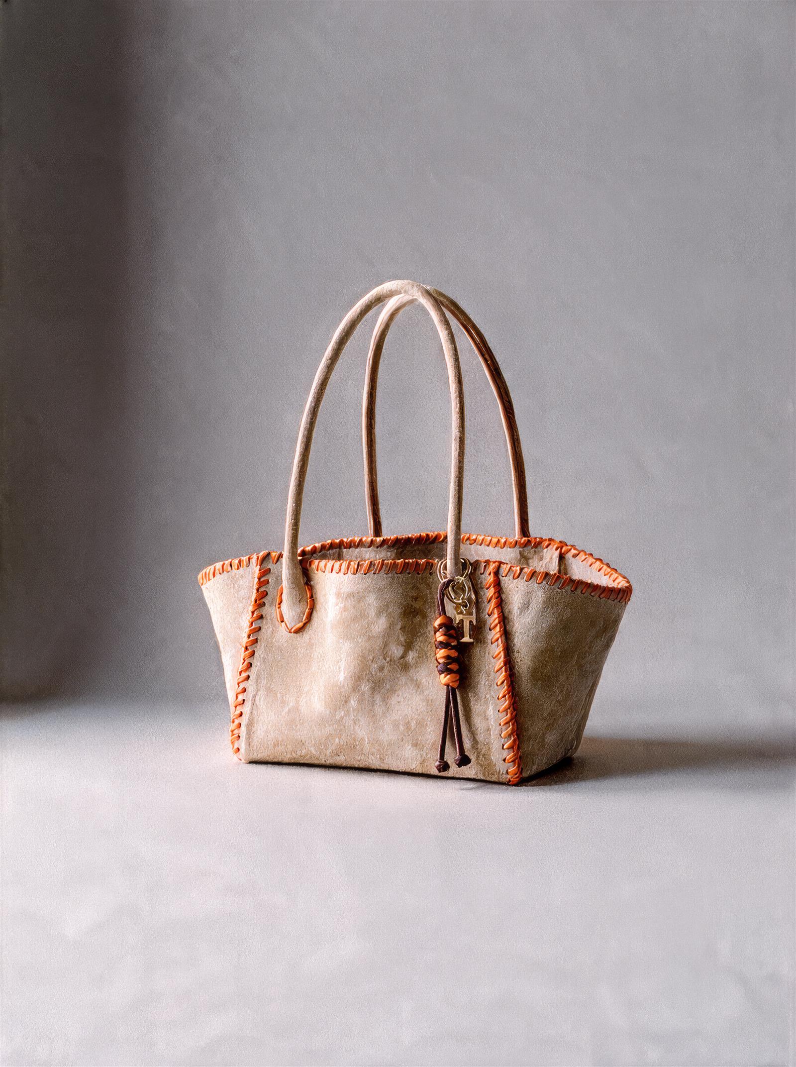 No. 1, Mini: light beige suede dog bag with orange saddle stitching and charms